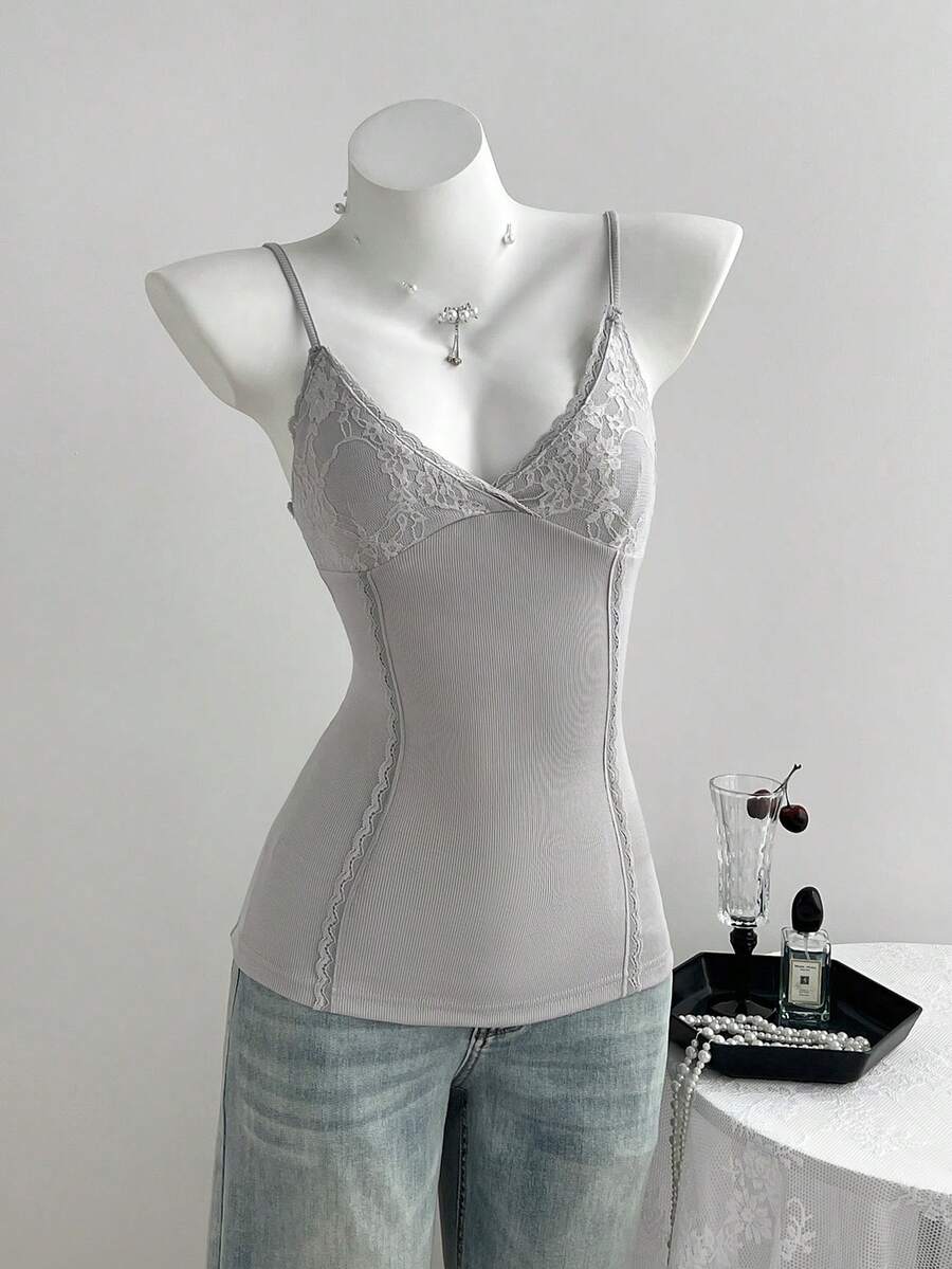Women's slim fit backless cami tank top with contrast lace patchwork details, spaghetti straps, and high-stretch knitted ribbed fabric.