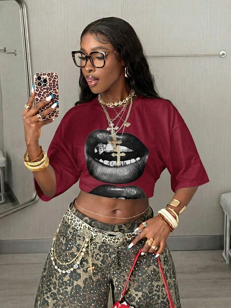 Women's oversized graphic crew neck t-shirt made of 100% white cotton knitted fabric with drop shoulder half sleeves.