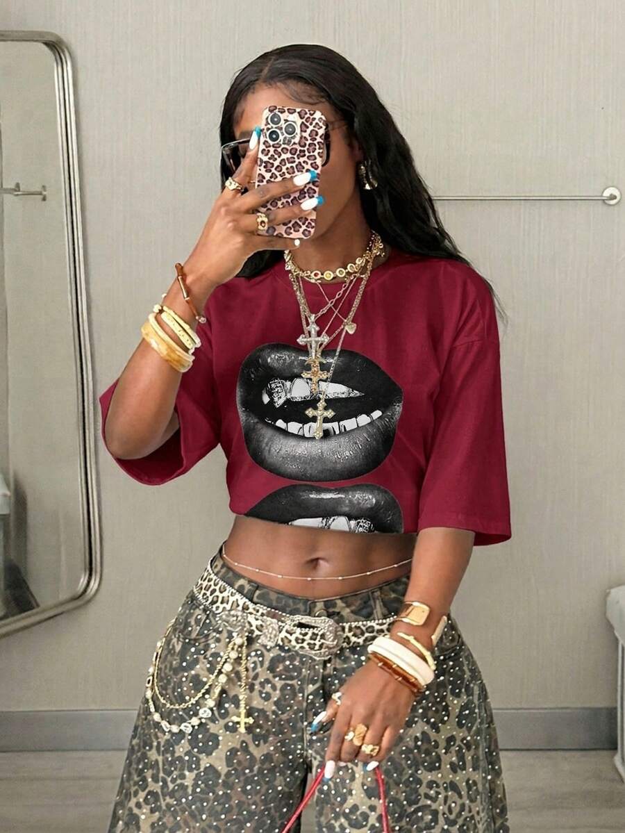 Women's oversized graphic crew neck t-shirt made of 100% white cotton knitted fabric with drop shoulder half sleeves.