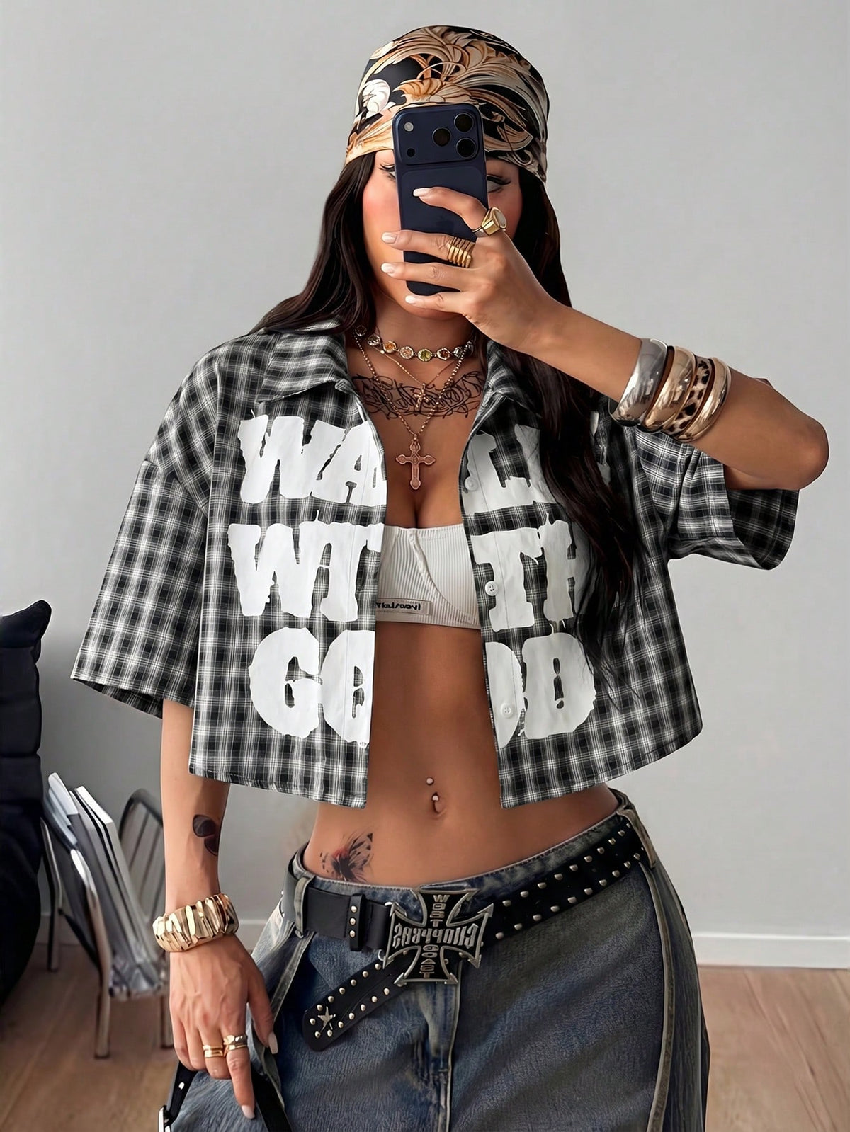 Women's plaid crop shirt with button front, chest pocket, short sleeves, and loose casual fit.