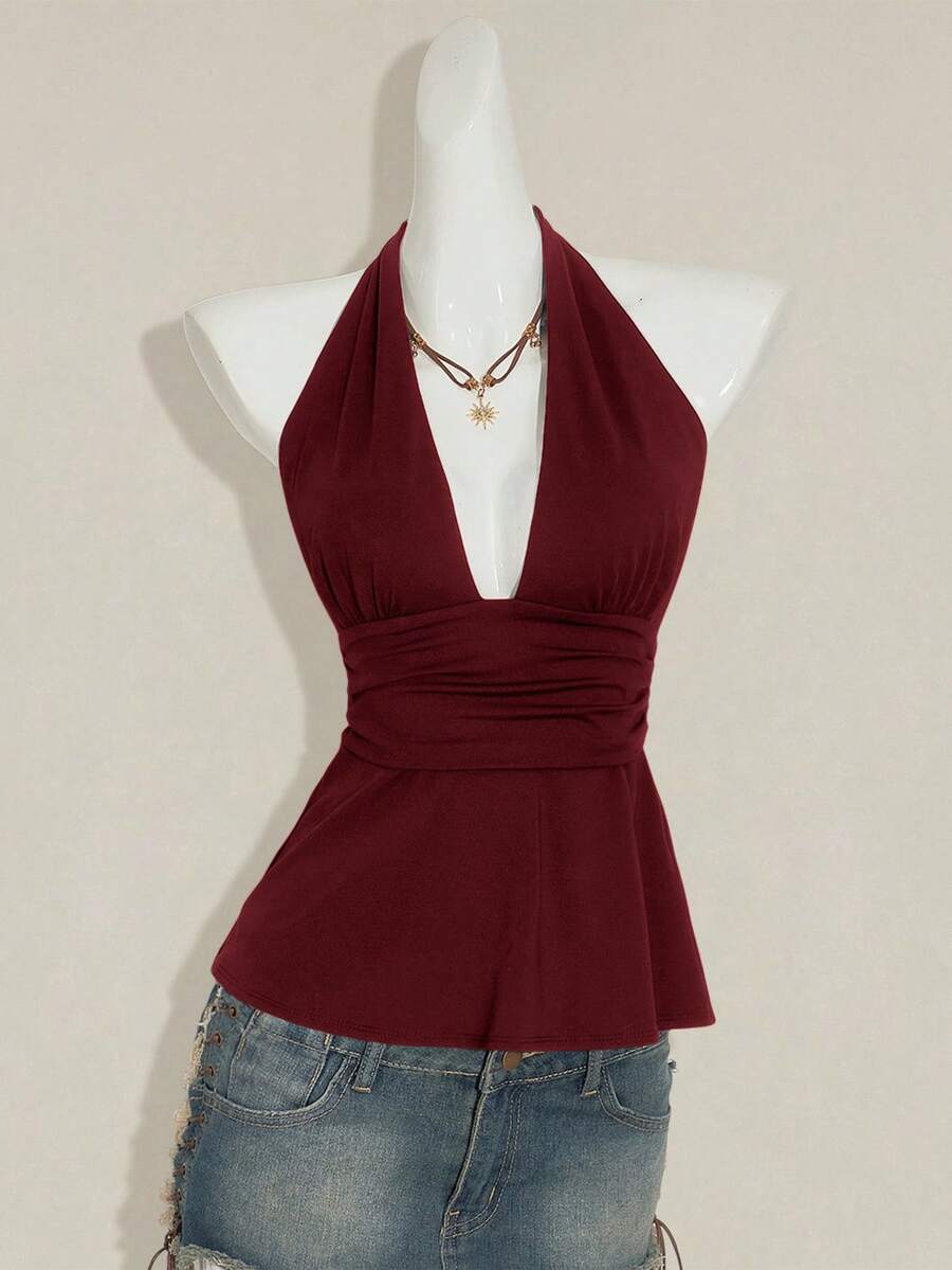 Women's backless halter babydoll tank top featuring a square neckline, slim fit silhouette, and a flared ruffle hem.