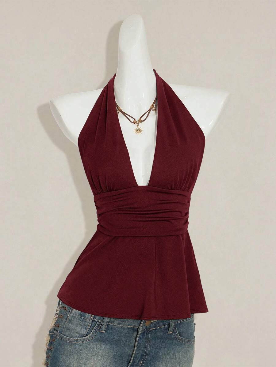 Women's backless halter babydoll tank top featuring a square neckline, slim fit silhouette, and a flared ruffle hem.