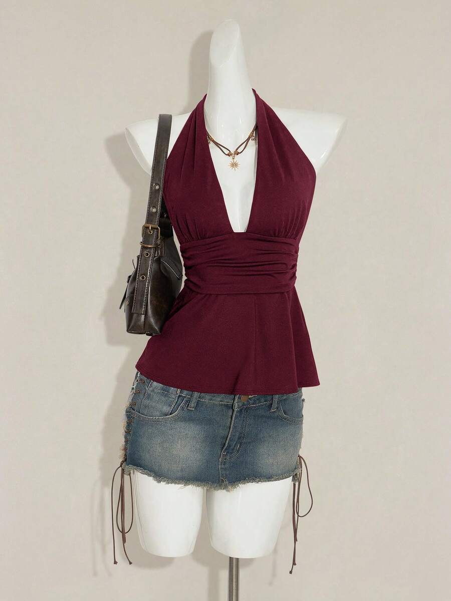 Women's backless halter babydoll tank top featuring a square neckline, slim fit silhouette, and a flared ruffle hem.