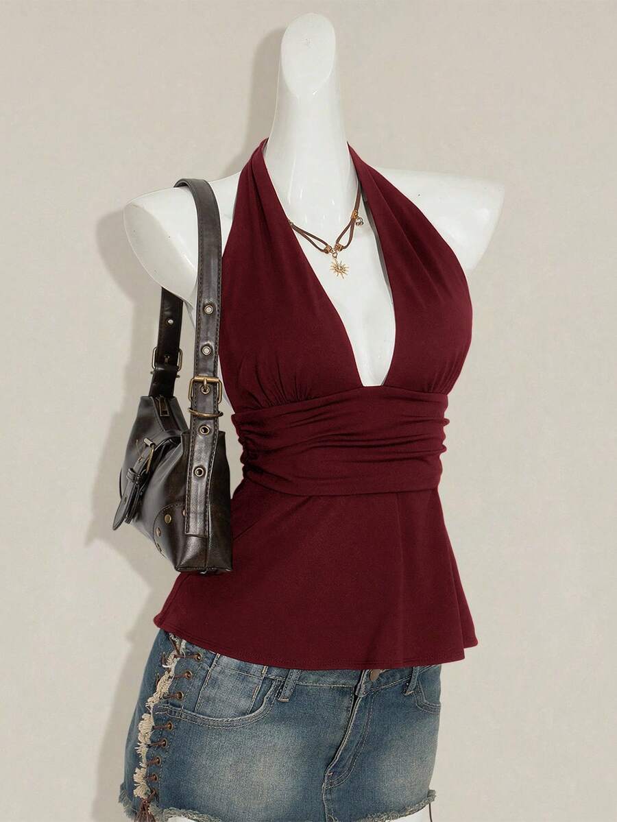 Women's backless halter babydoll tank top featuring a square neckline, slim fit silhouette, and a flared ruffle hem.