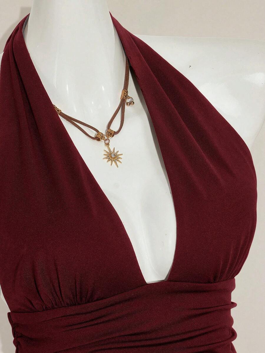 Women's backless halter babydoll tank top featuring a square neckline, slim fit silhouette, and a flared ruffle hem.