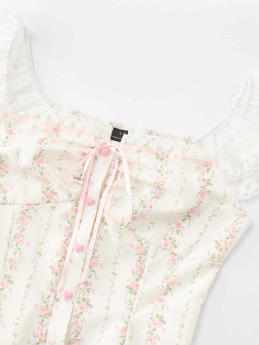 Vintage ditsy floral print sleeveless women's blouse with square neck, ruffle trim, and slim fit style.
