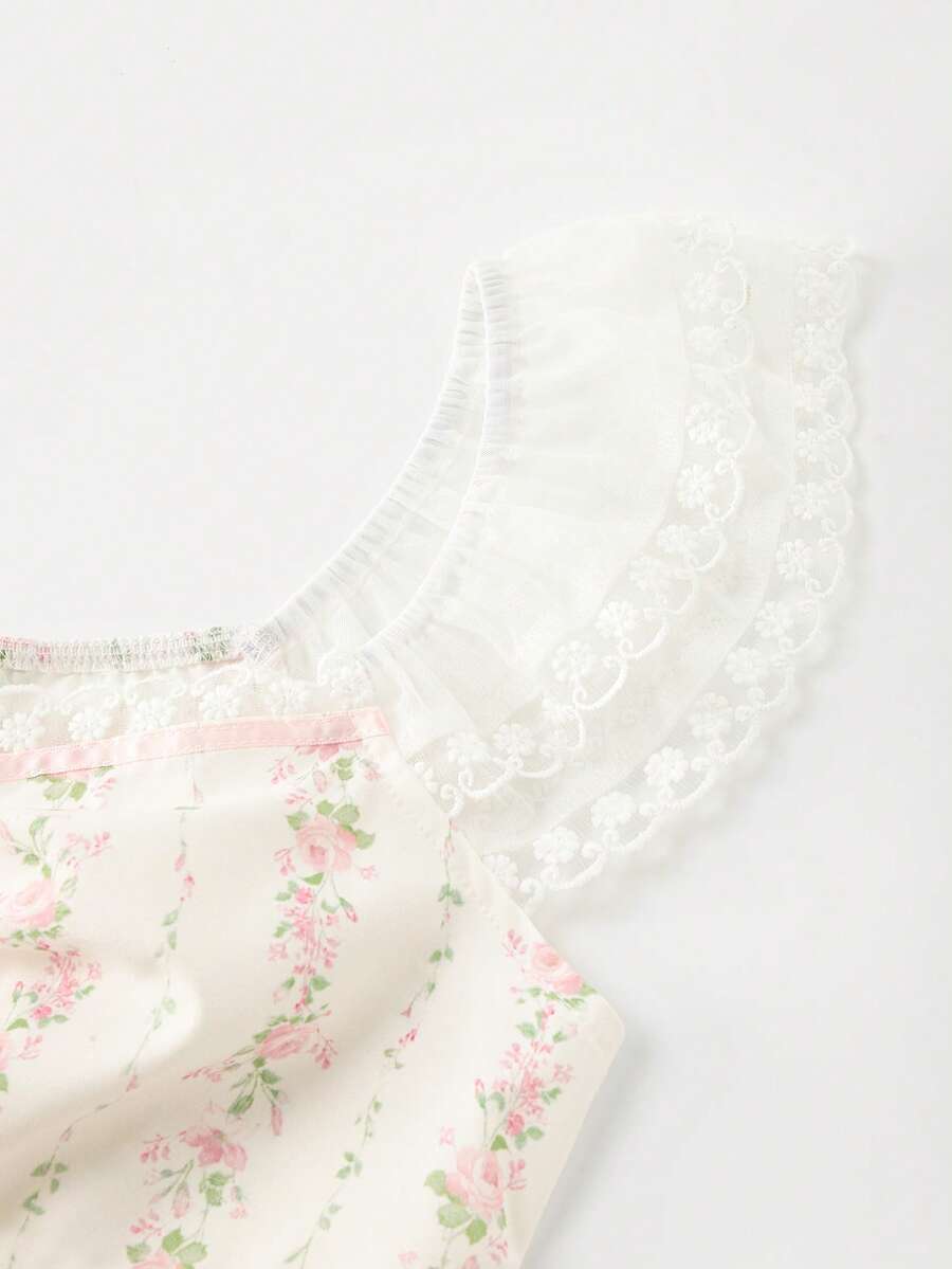 Vintage ditsy floral print sleeveless women's blouse with square neck, ruffle trim, and slim fit style.