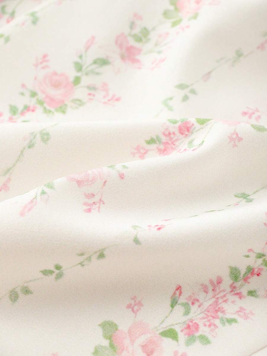 Vintage ditsy floral print sleeveless women's blouse with square neck, ruffle trim, and slim fit style.