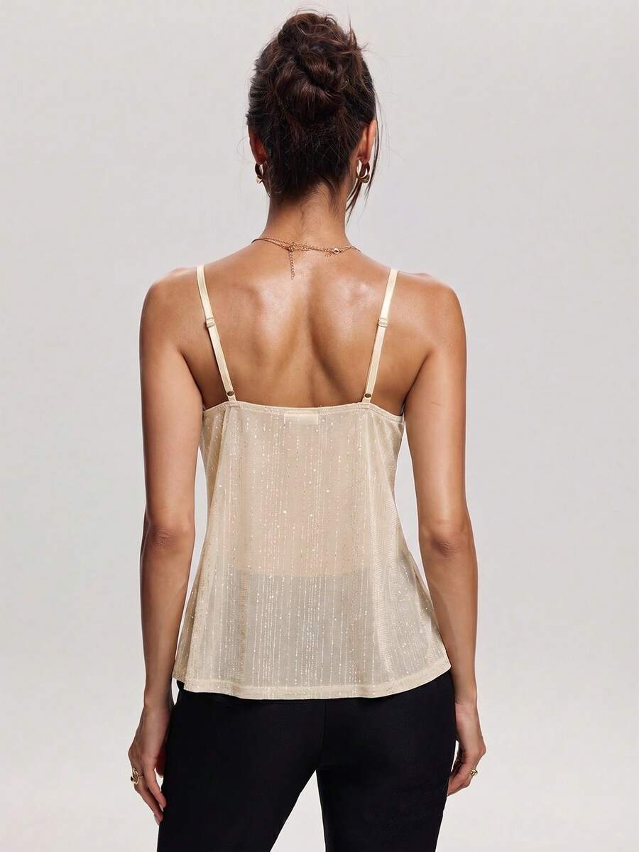 Women's backless spaghetti strap camisole top featuring contrast lace details, knot accents, and a slim fit.