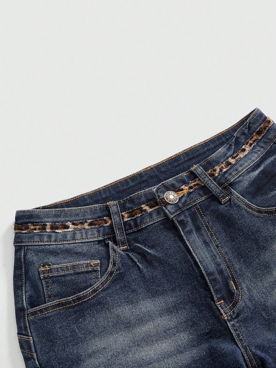 Women's super low waist shorts with leopard print embroidery, button and zipper closure, and raw hem detailing.
