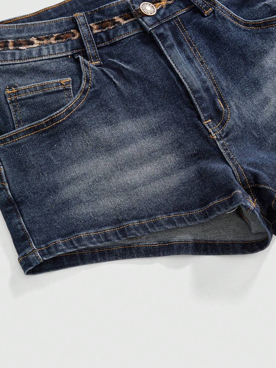 Women's super low waist shorts with leopard print embroidery, button and zipper closure, and raw hem detailing.