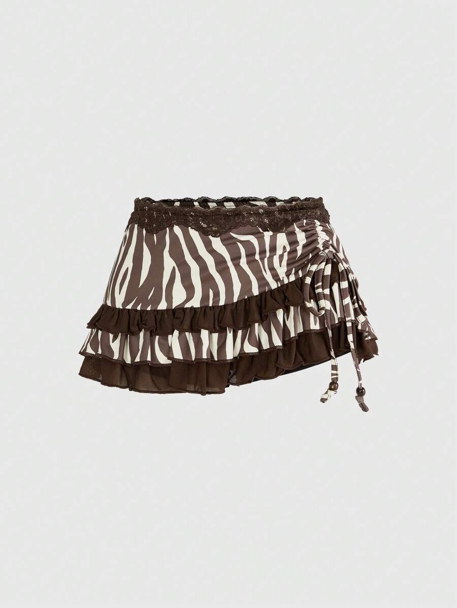 Women's black low-waist mini skirt with drawstring tie, ruched details, lace trim, layered ruffle hem, and asymmetric styling
