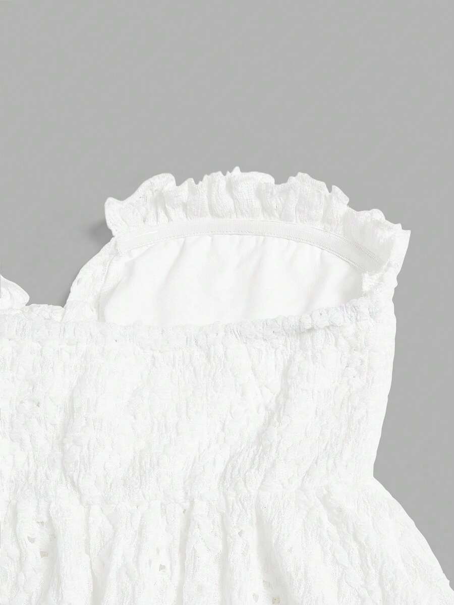 Elenzga white knitted sleeveless camisole top featuring spaghetti straps, front bow detail, hollow-out waist, and frill trim hem.