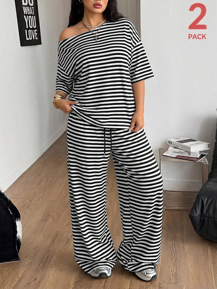 Women's casual two-piece outfit featuring a loose short-sleeve asymmetrical neck t-shirt and matching long wide leg pants with pockets.