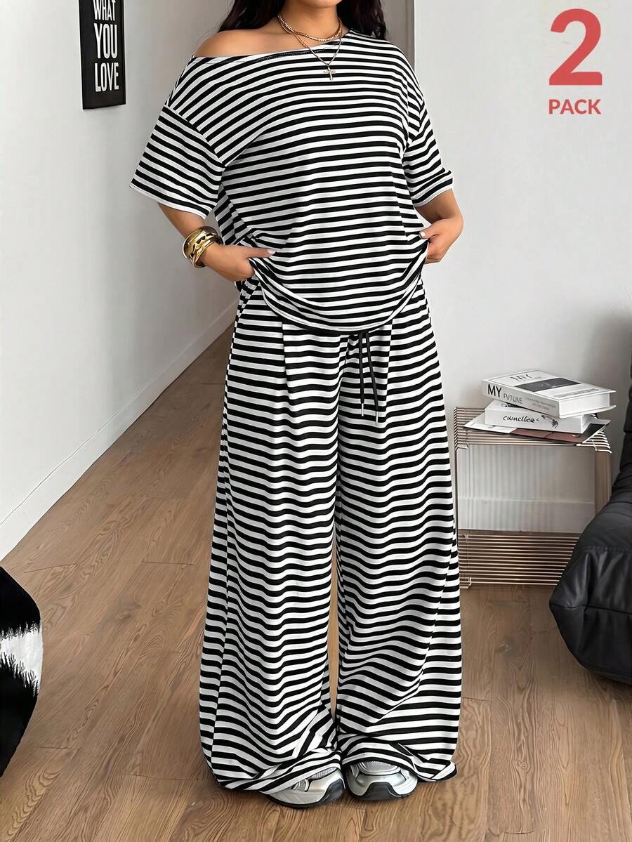 Women's casual two-piece outfit featuring a loose short-sleeve asymmetrical neck t-shirt and matching long wide leg pants with pockets.