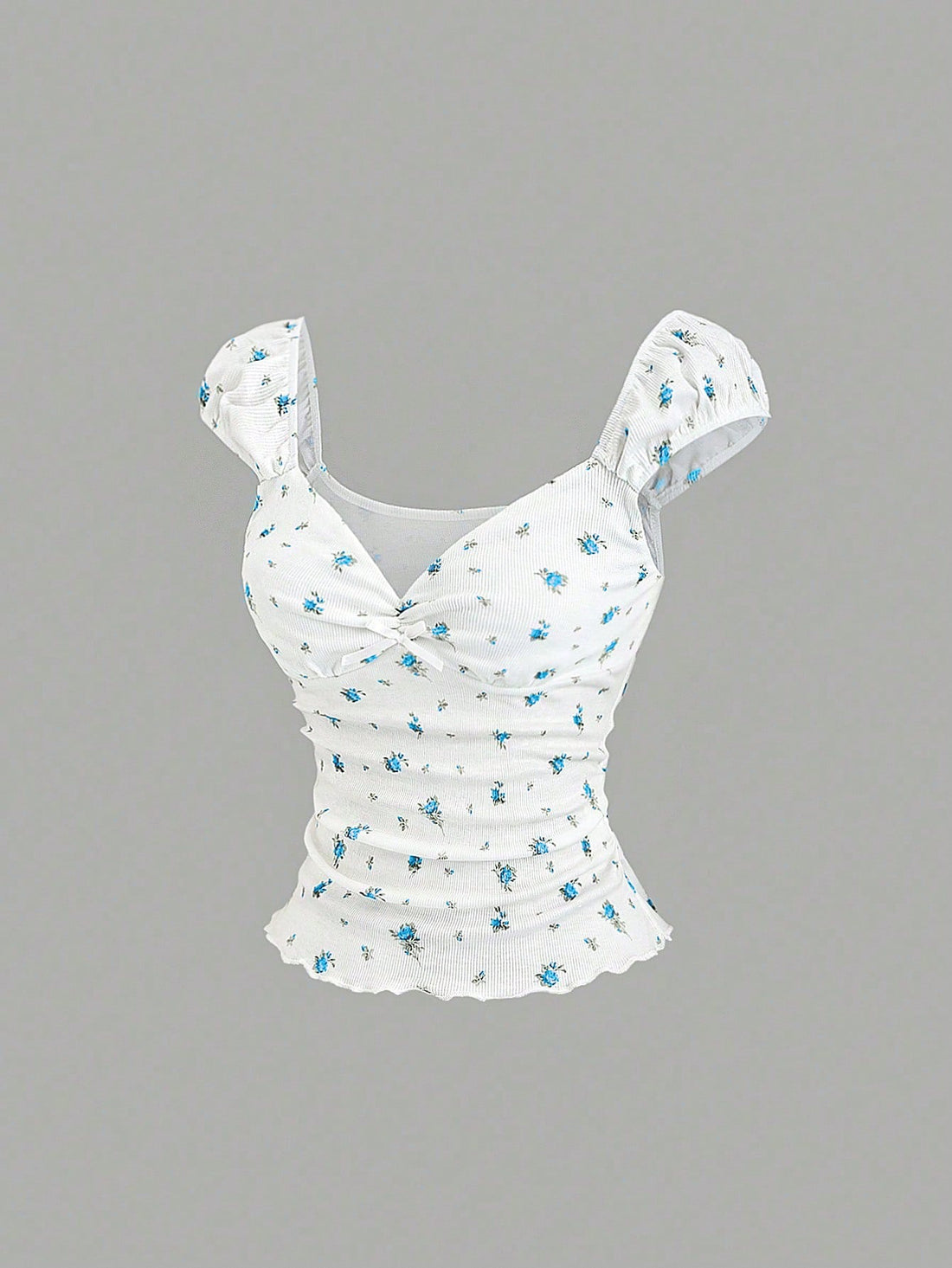 Women's short sleeve knit top with a sweetheart neckline and ruched twist knot front detail.