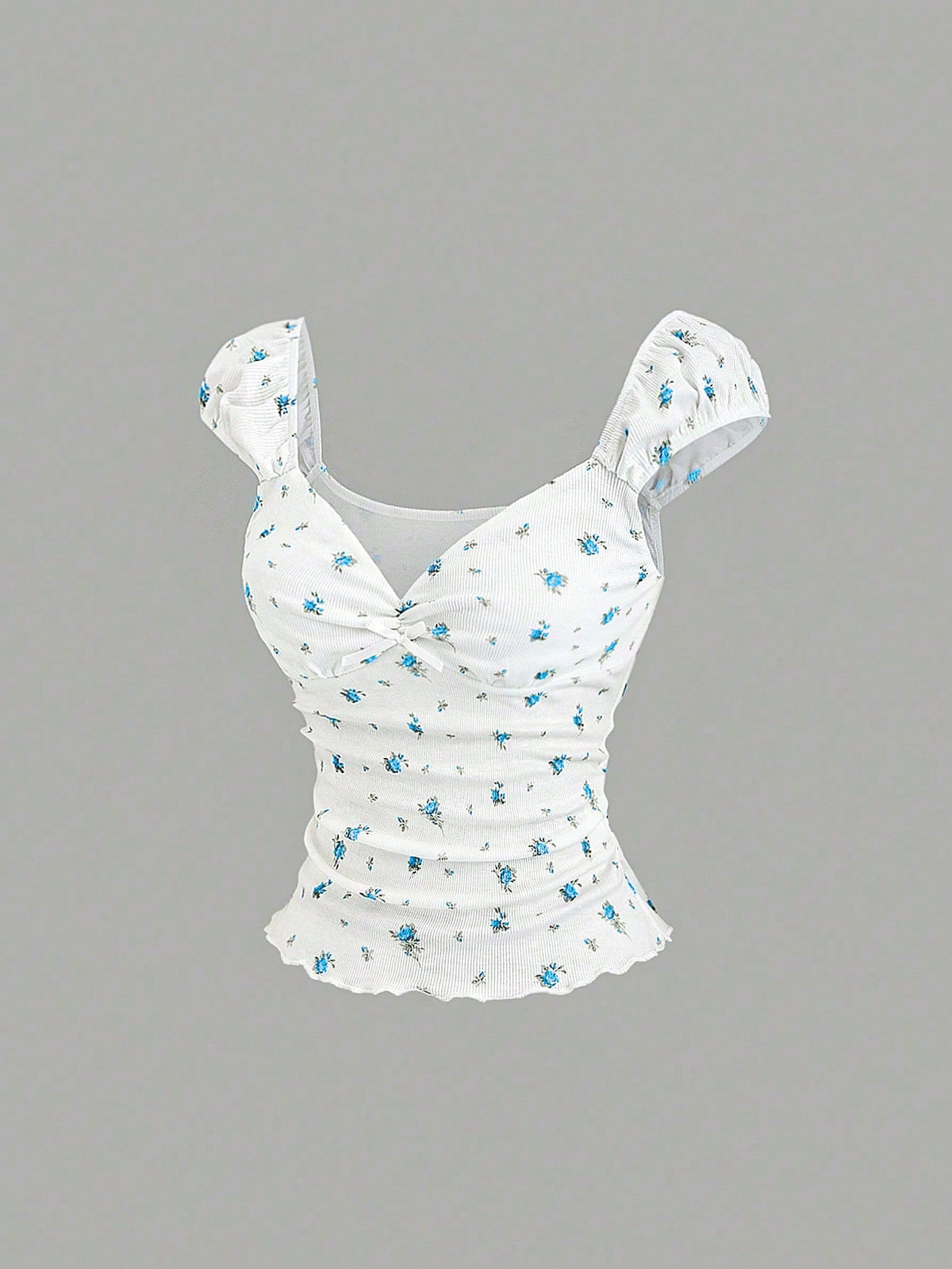 Women's short sleeve knit top with a sweetheart neckline and ruched twist knot front detail.