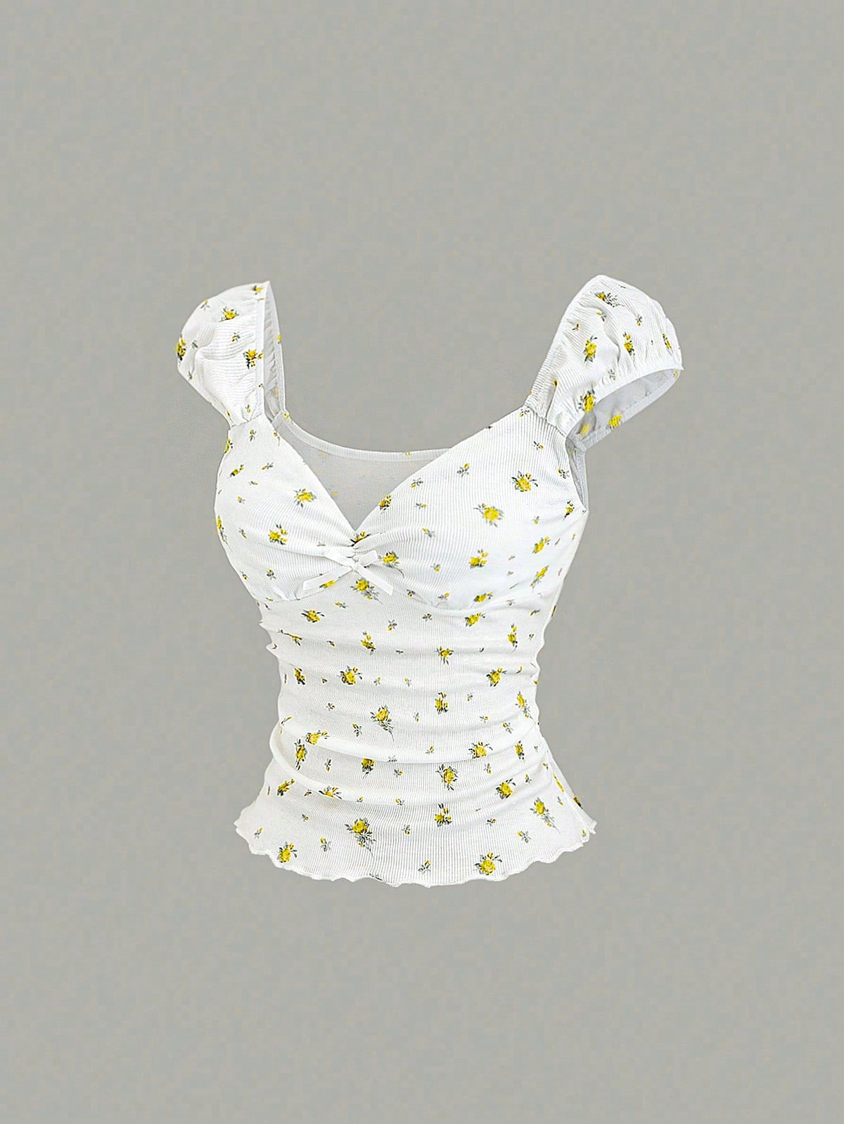 Women's short sleeve knit top with a sweetheart neckline and ruched twist knot front detail.