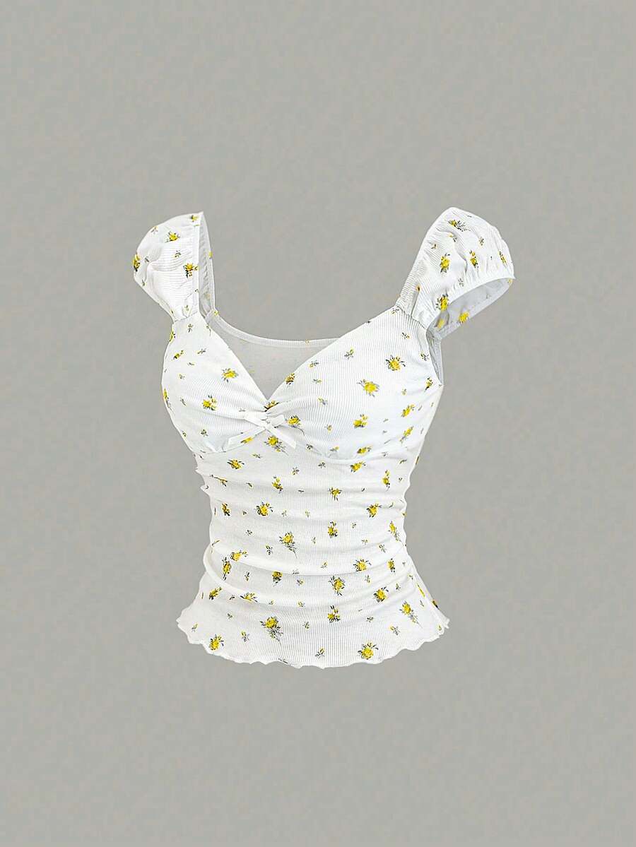 Women's short sleeve knit top with a sweetheart neckline and ruched twist knot front detail.