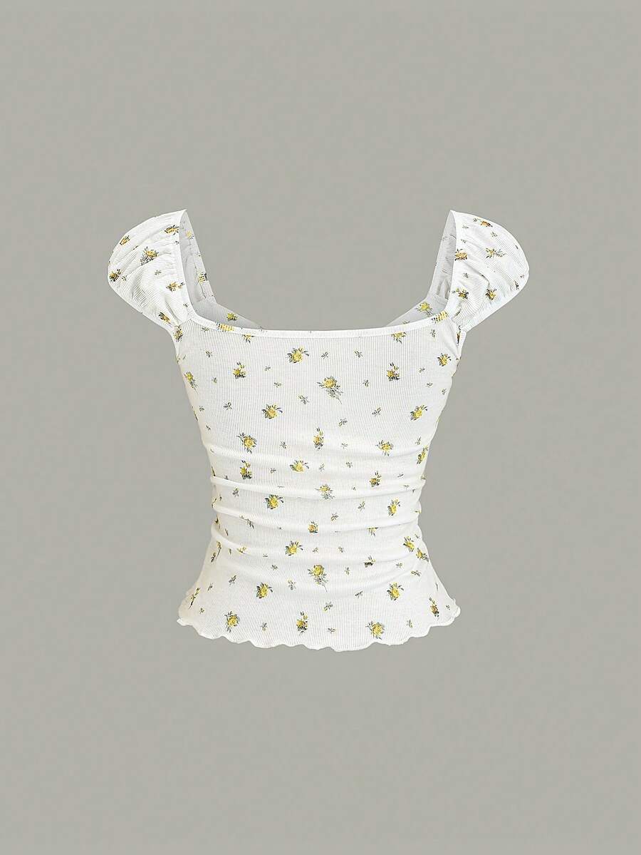 Women's short sleeve knit top with a sweetheart neckline and ruched twist knot front detail.
