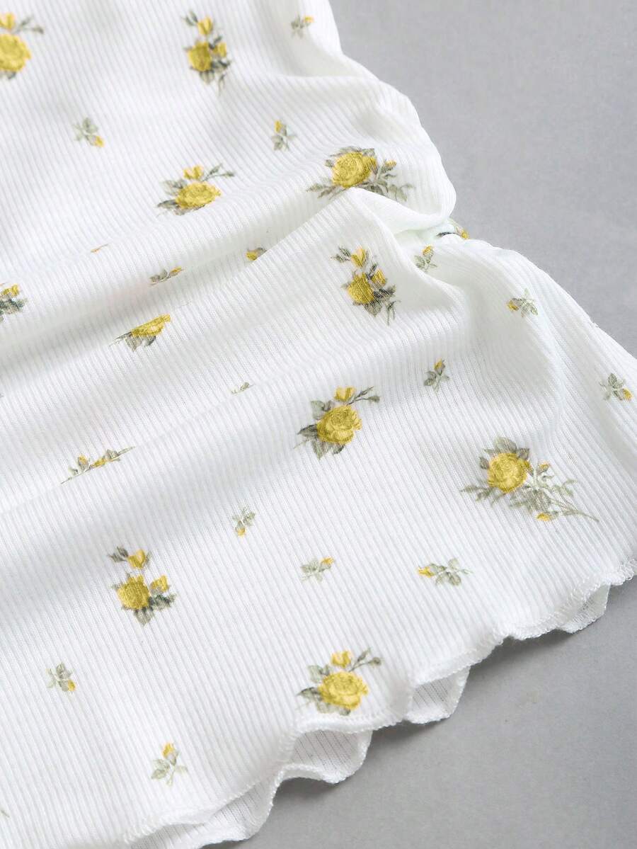 Women's short sleeve knit top with a sweetheart neckline and ruched twist knot front detail.