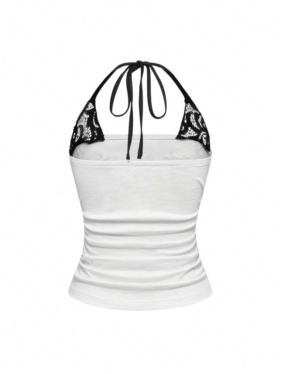 Women's cropped Y2K punk print halter cami top with contrast lace, backless knot detail, and slim fit knitted fabric