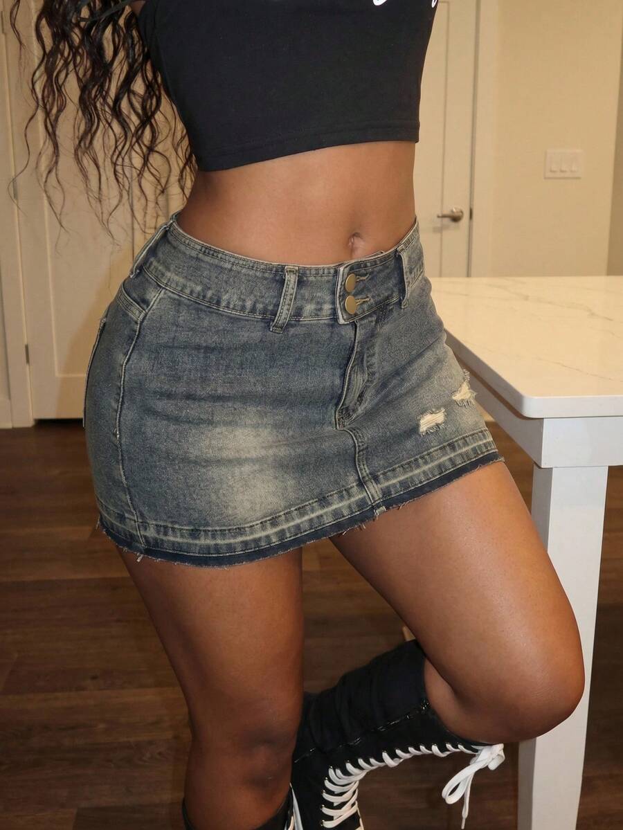 Women's black low waist bodycon mini skirt with button detail, pockets, and zipper closure