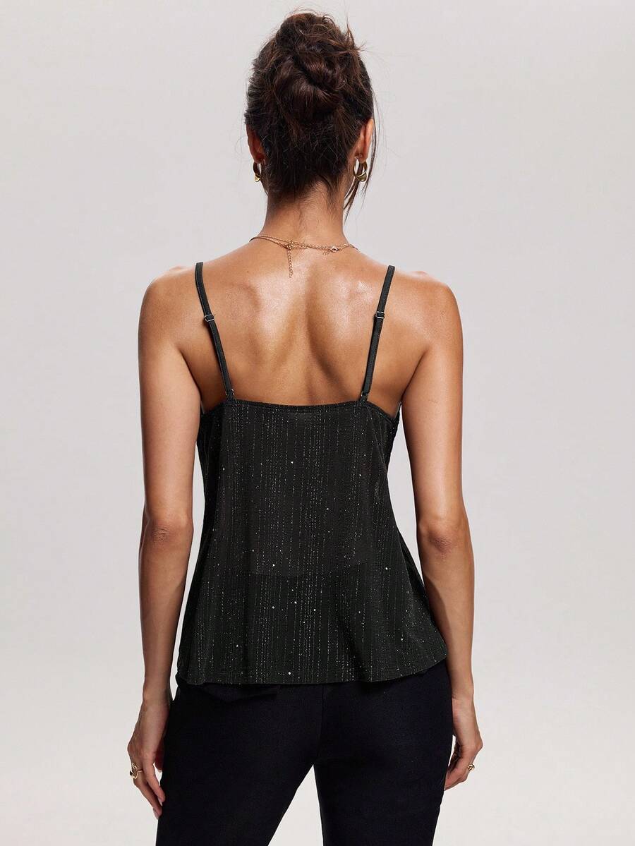 Women's backless spaghetti strap camisole top featuring contrast lace details, knot accents, and a slim fit.