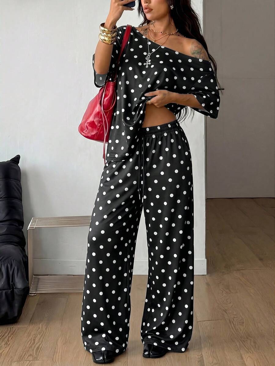 Women's two-piece outfit featuring an oversized asymmetrical neck t-shirt and matching wide-leg drawstring sweatpants.