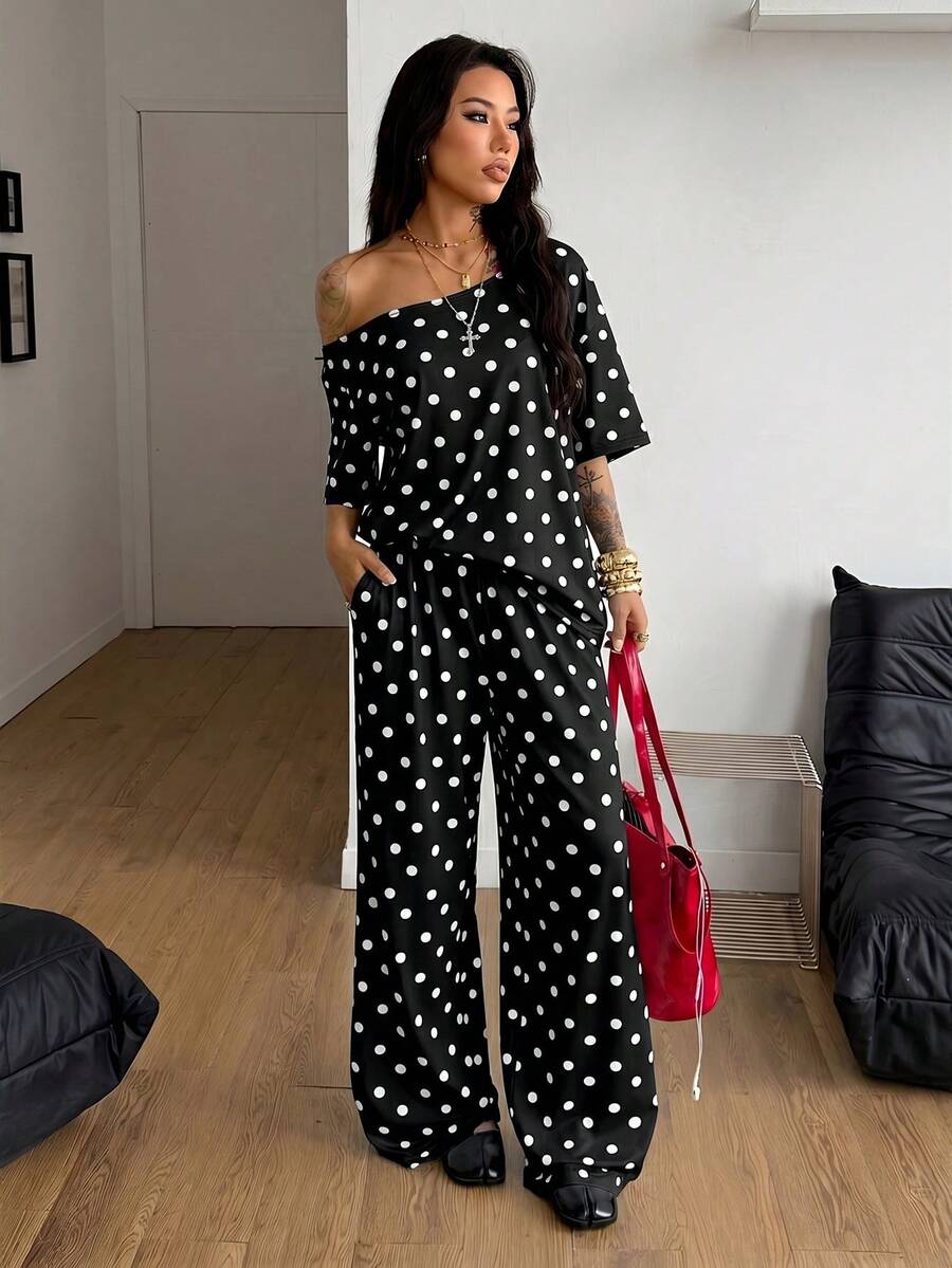 Women's two-piece outfit featuring an oversized asymmetrical neck t-shirt and matching wide-leg drawstring sweatpants.