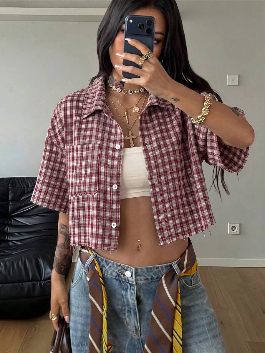 Women's plaid crop shirt with button front, chest pocket, short sleeves, and loose casual fit.