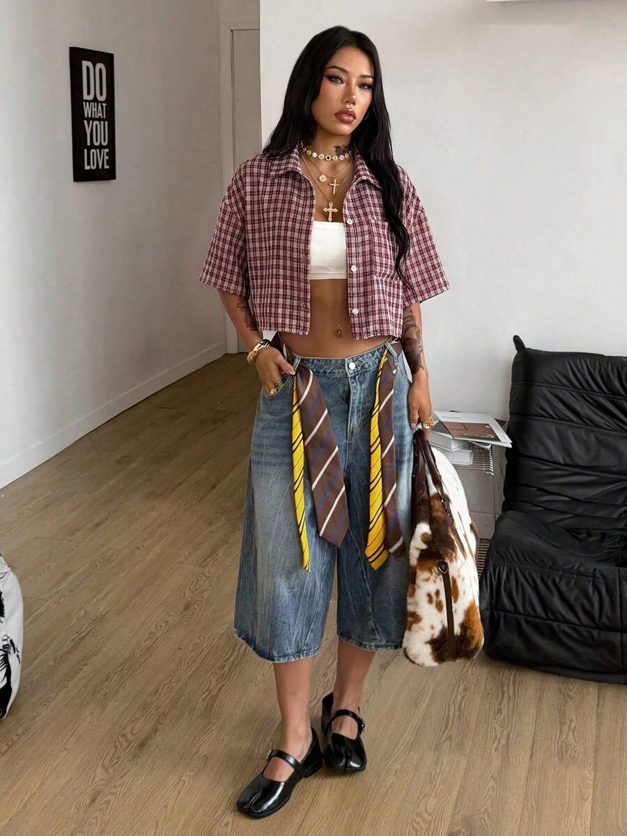 Women's plaid crop shirt with button front, chest pocket, short sleeves, and loose casual fit.
