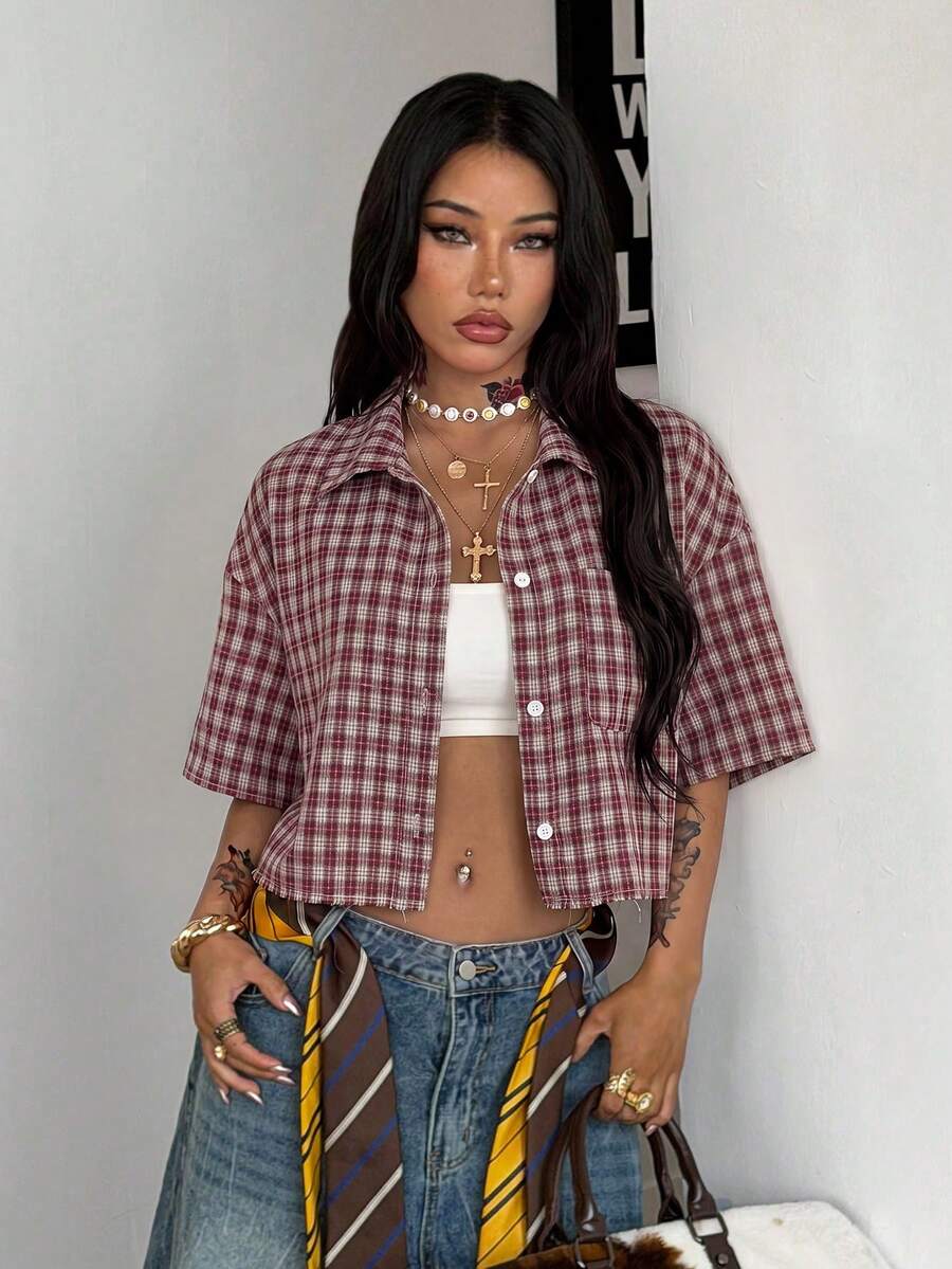 Women's plaid crop shirt with button front, chest pocket, short sleeves, and loose casual fit.