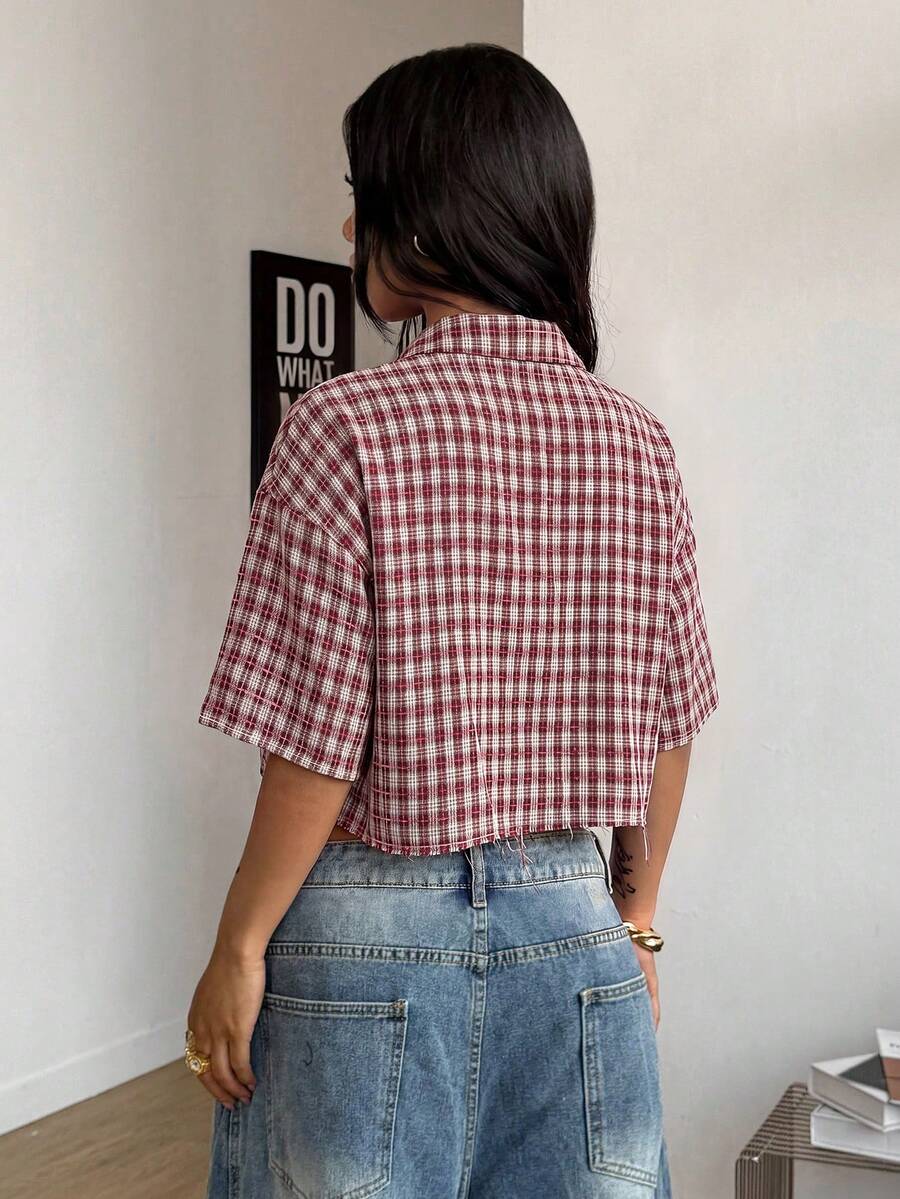 Women's plaid crop shirt with button front, chest pocket, short sleeves, and loose casual fit.