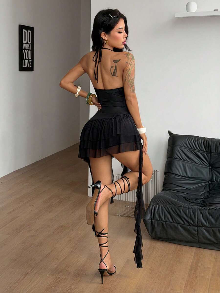 Black sleeveless mesh halter bodycon mini dress for women with flounce ruffle hem and striped pattern.