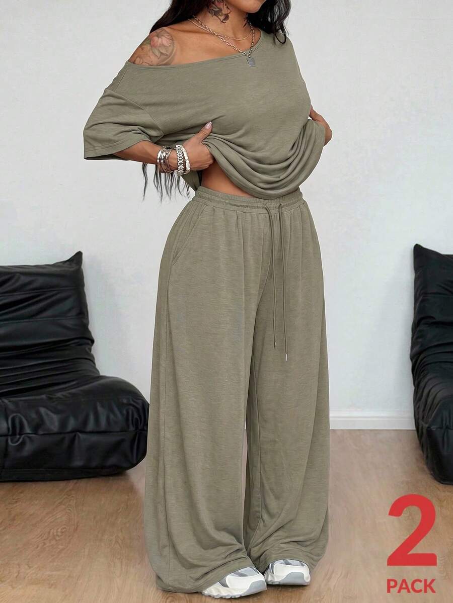 Women's two-piece lounge set featuring a loose drop shoulder asymmetrical neck short sleeve t-shirt and wide-leg knit pants with pockets.