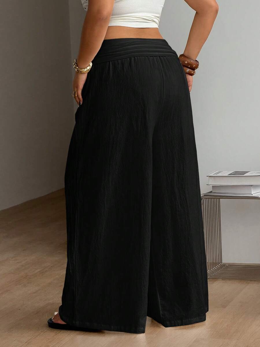 Women's plus size wide leg cotton pants featuring a relaxed loose fit and high waist design.