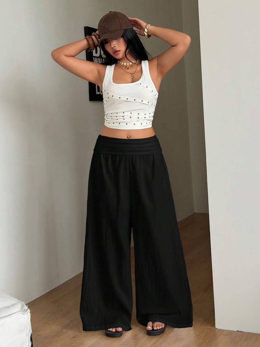 Women's plus size wide leg cotton pants featuring a relaxed loose fit and high waist design.