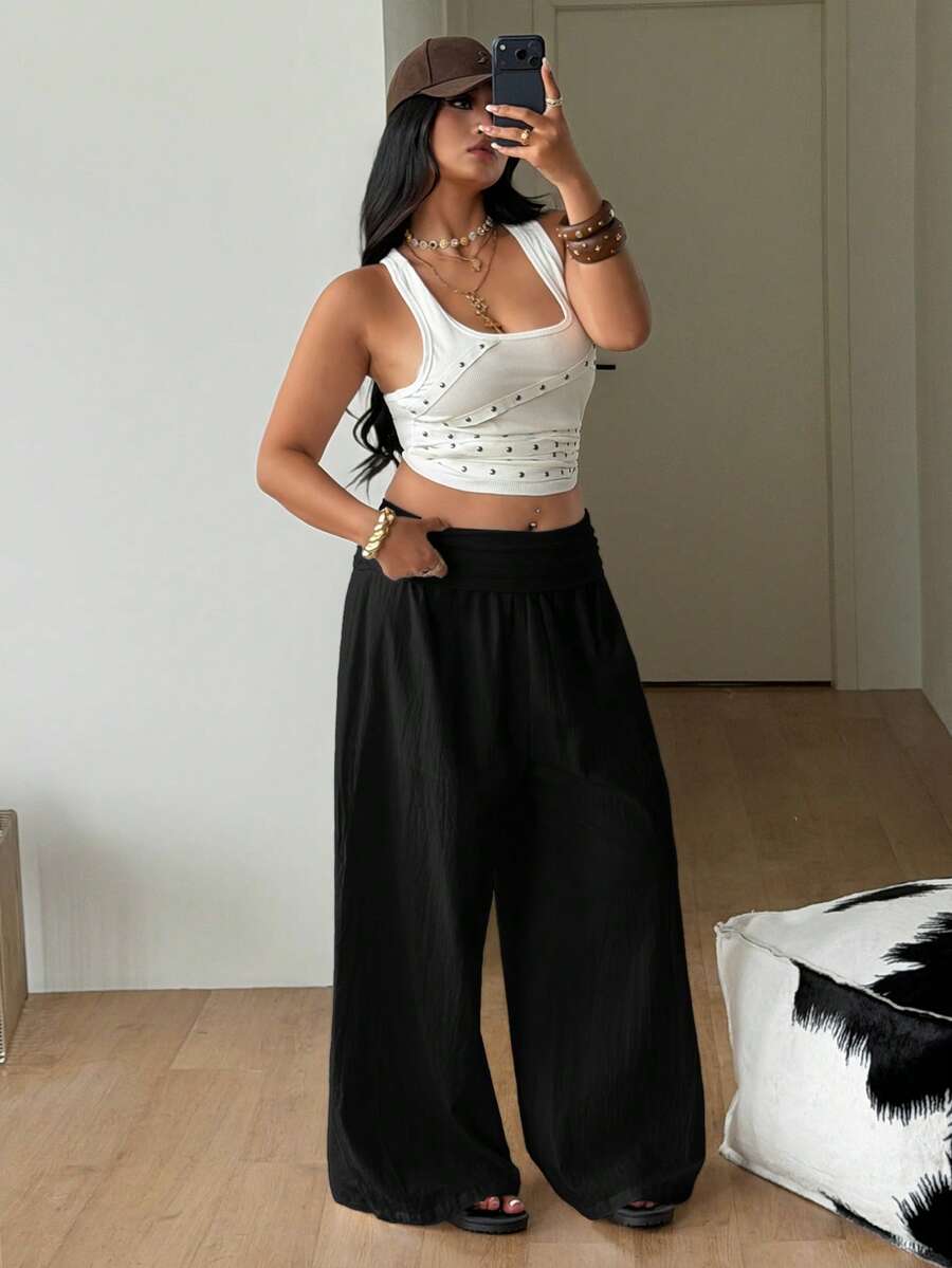 Women's plus size wide leg cotton pants featuring a relaxed loose fit and high waist design.