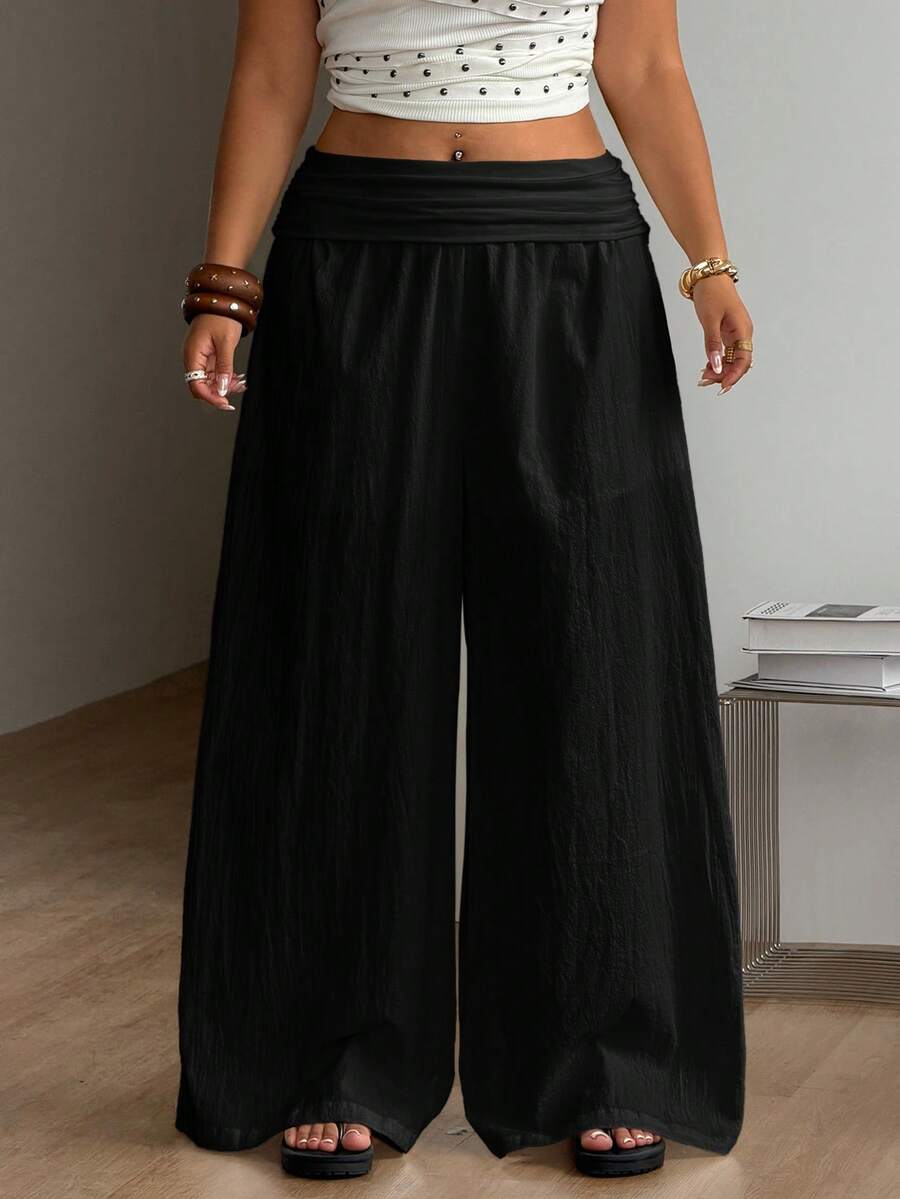 Women's plus size wide leg cotton pants featuring a relaxed loose fit and high waist design.
