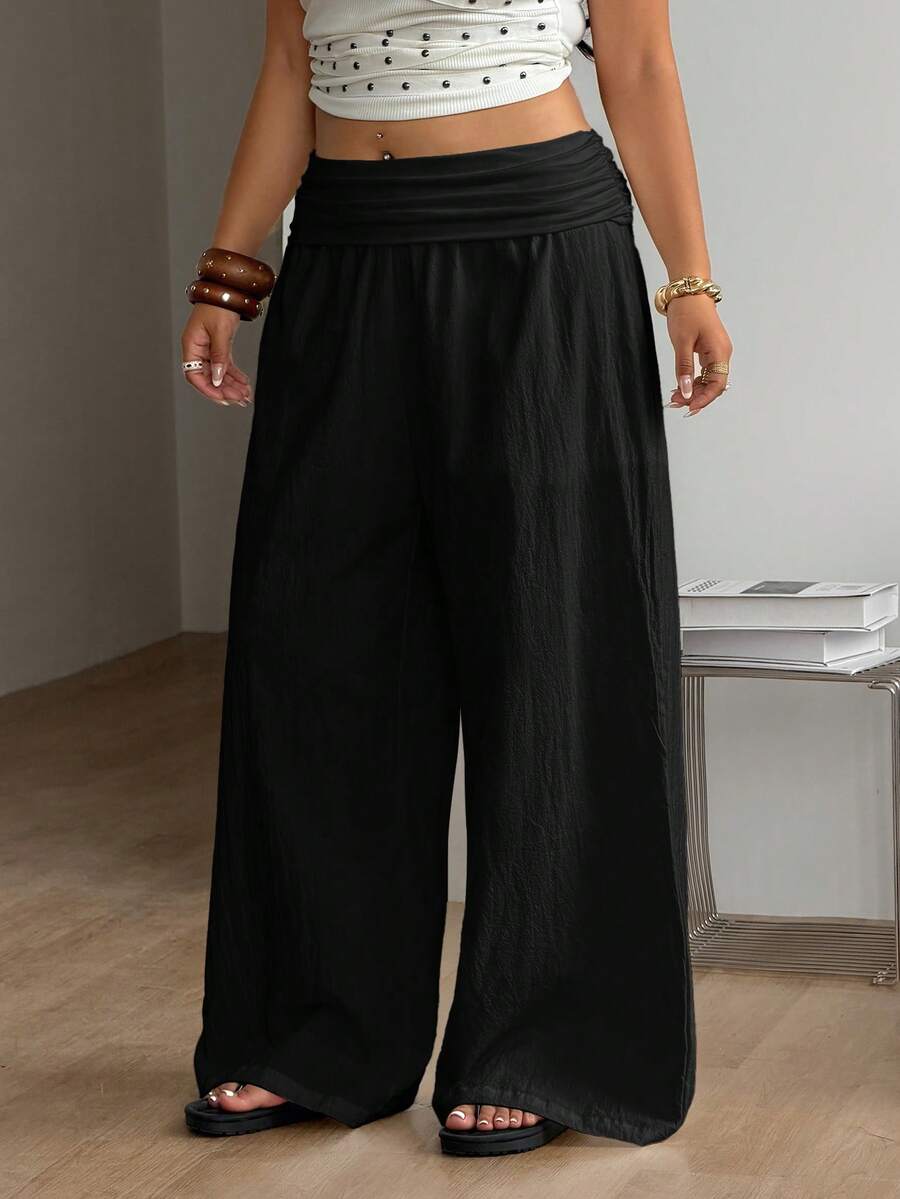 Women's plus size wide leg cotton pants featuring a relaxed loose fit and high waist design.