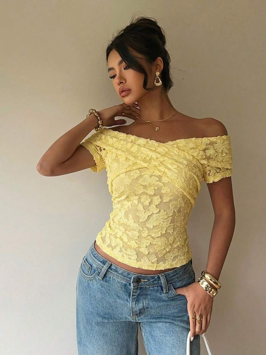 Women's off-the-shoulder slim fit short sleeve t-shirt featuring contrast lace trim and textured knitted fabric.