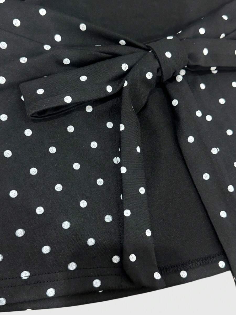 Women's cowl neck tie polka dot pleated tank blouse with ruched details and a regular fit