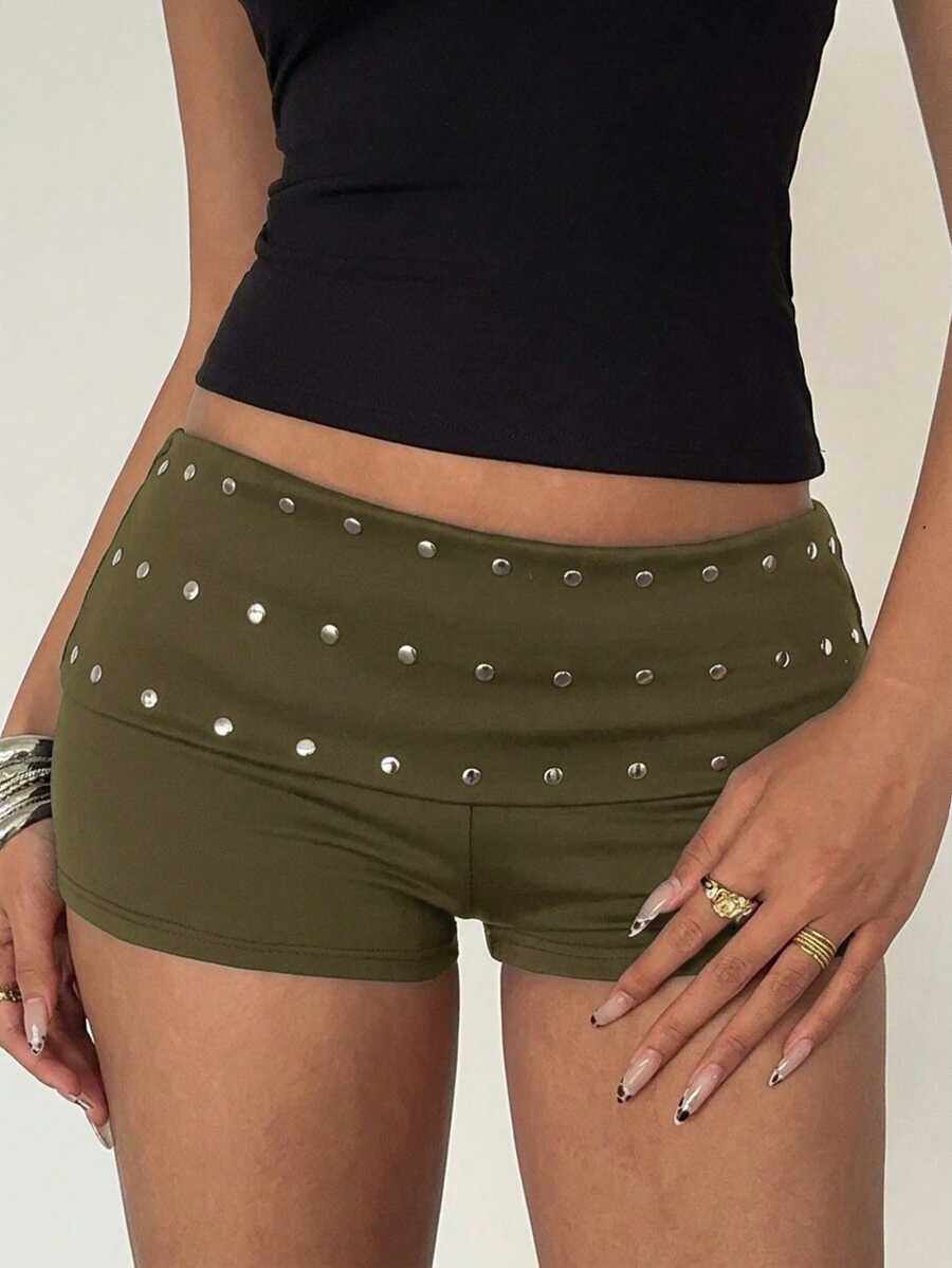 Women's studded PU ultra low waist mini shorts with zipper fly closure, skinny fit, mini length, and plain unlined design.