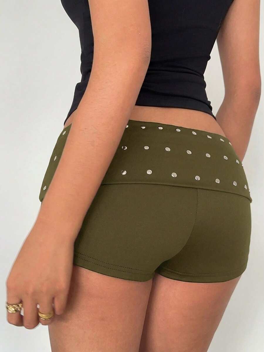 Women's studded PU ultra low waist mini shorts with zipper fly closure, skinny fit, mini length, and plain unlined design.