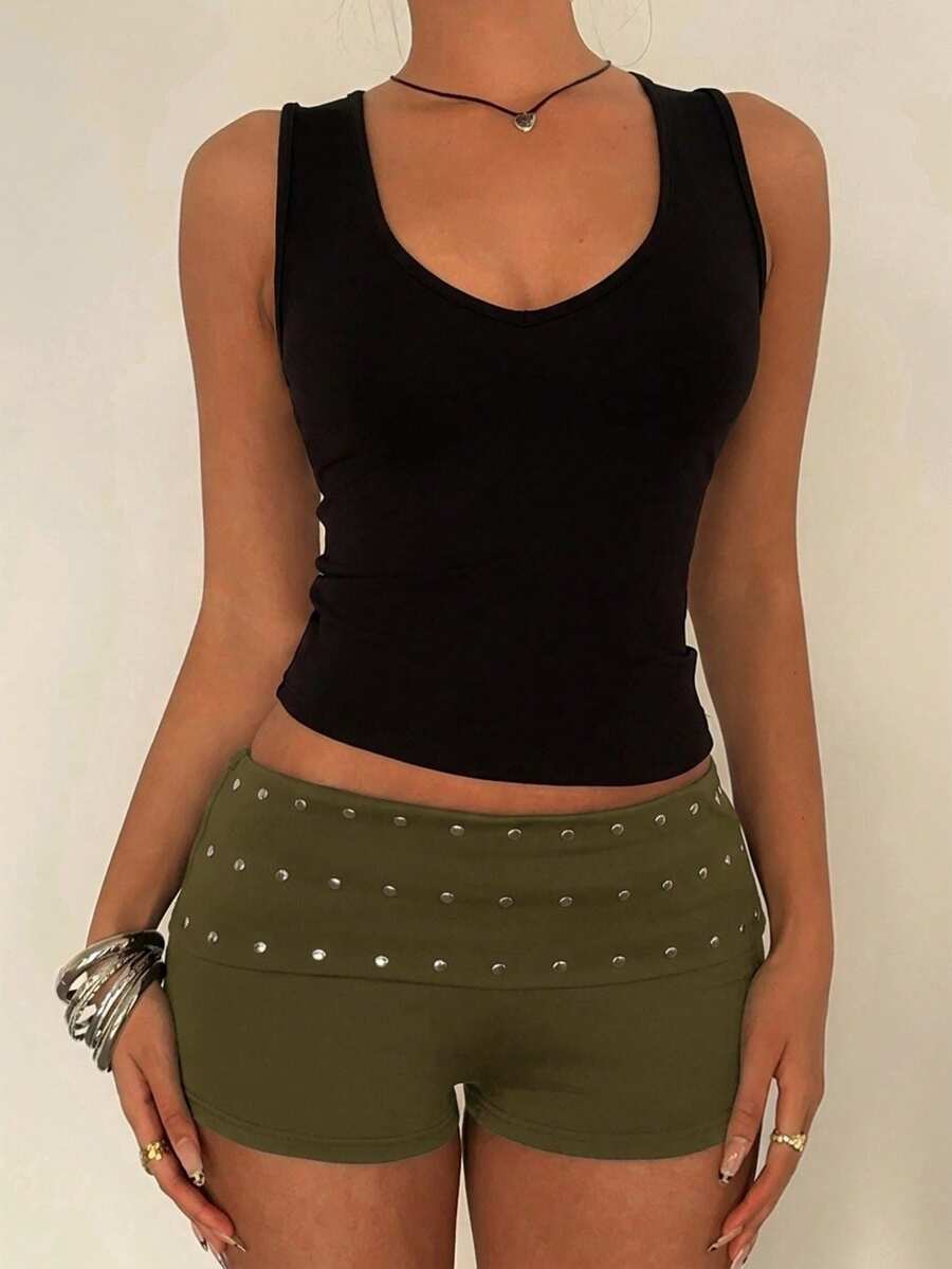 Women's studded PU ultra low waist mini shorts with zipper fly closure, skinny fit, mini length, and plain unlined design.
