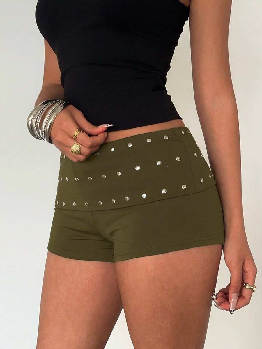 Women's studded PU ultra low waist mini shorts with zipper fly closure, skinny fit, mini length, and plain unlined design.
