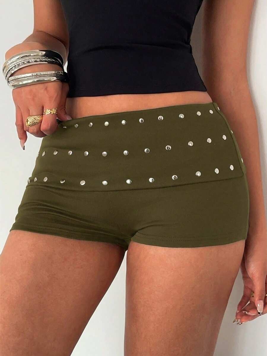 Women's studded PU ultra low waist mini shorts with zipper fly closure, skinny fit, mini length, and plain unlined design.
