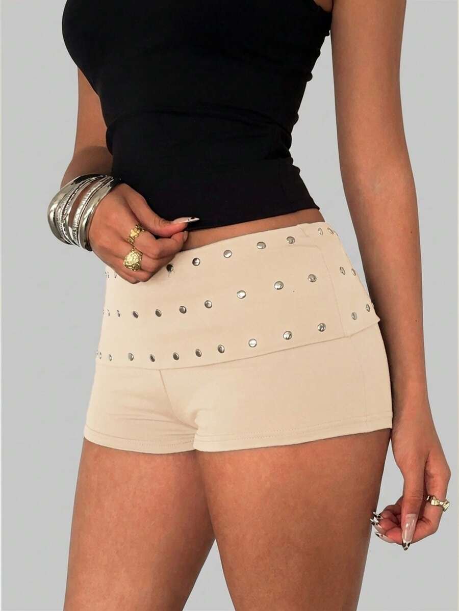 Women's studded PU ultra low waist mini shorts with zipper fly closure, skinny fit, mini length, and plain unlined design.