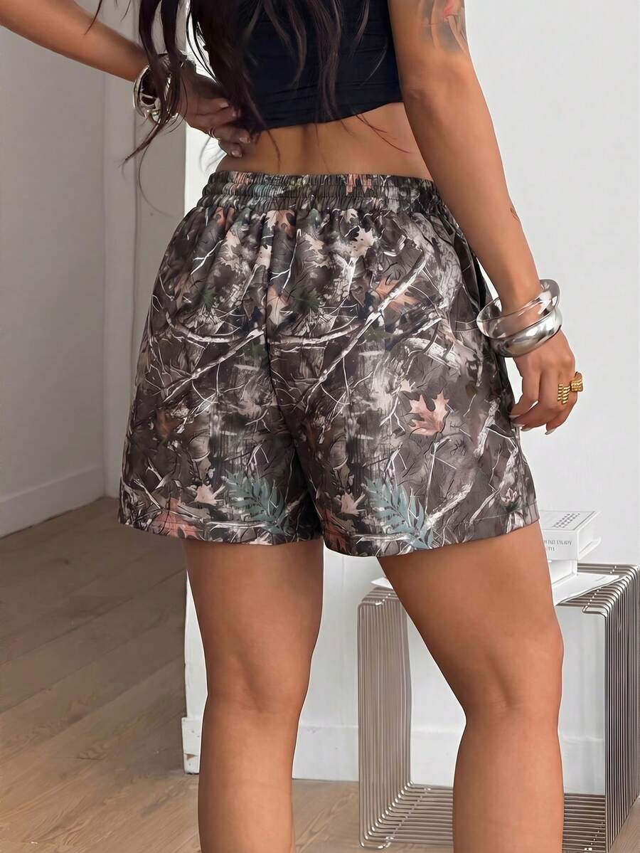 Women's casual drawstring track shorts featuring front pockets and embroidered details